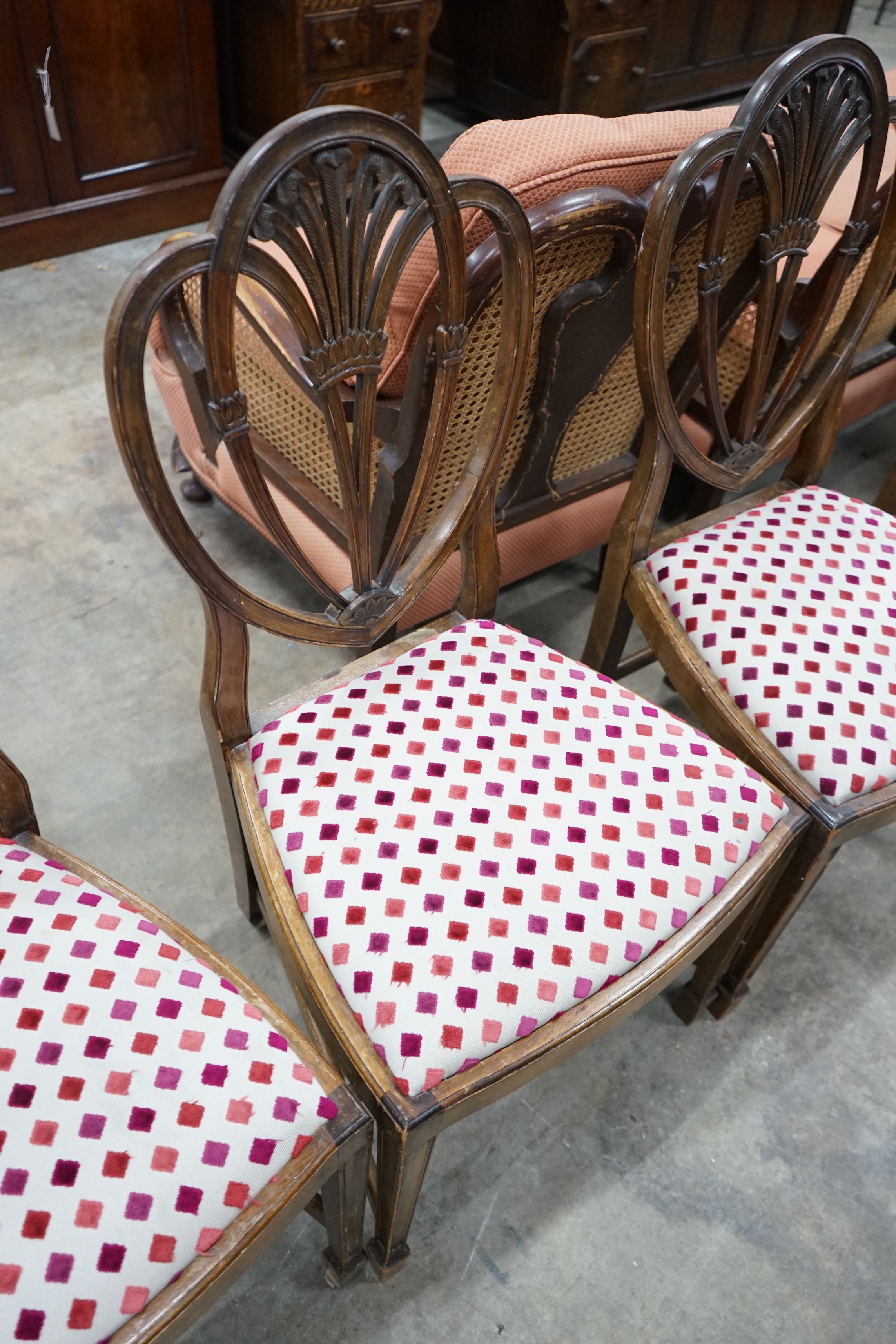 A set of eight Hepplewhite style mahogany dining chairs, two with arms